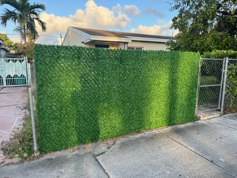 Chain-link front fence after: solid green privacy wall