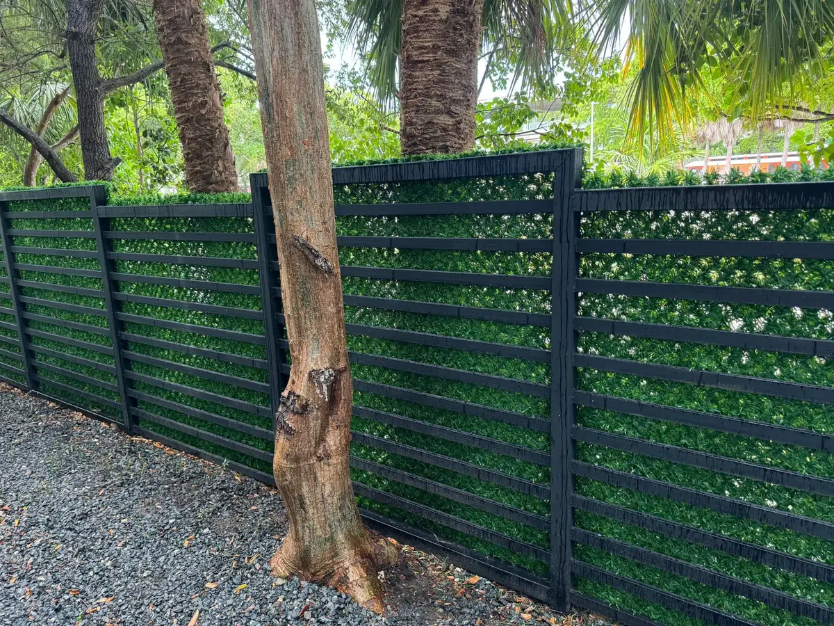 Slat fence covered with Dolce Green artificial grass fence